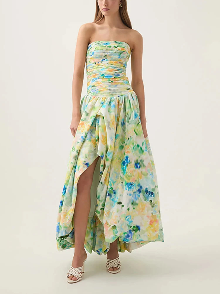 Woman wearing a strapless floral dress on a plain background