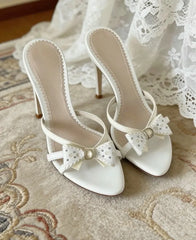 White bow accent heeled slides with stiletto heel