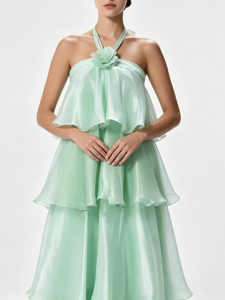 Close-up of halter neck tiered maxi dress neckline