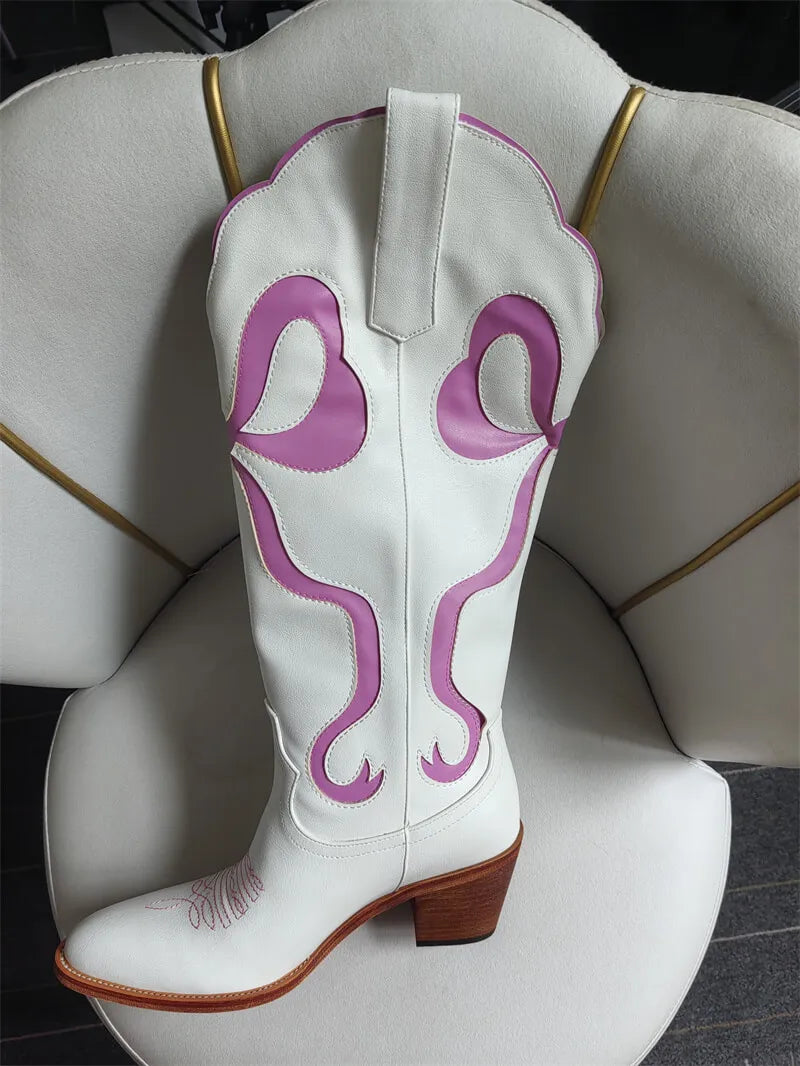 White cowboy boot with purple designs on a white chair