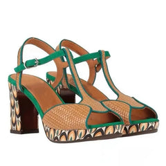  Close-up of textured leather platform sandals with square toe and thick heel. 1