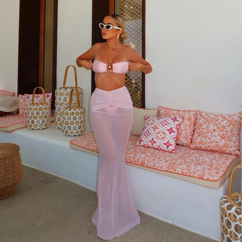 Pink bikini top and sheer maxi skirt