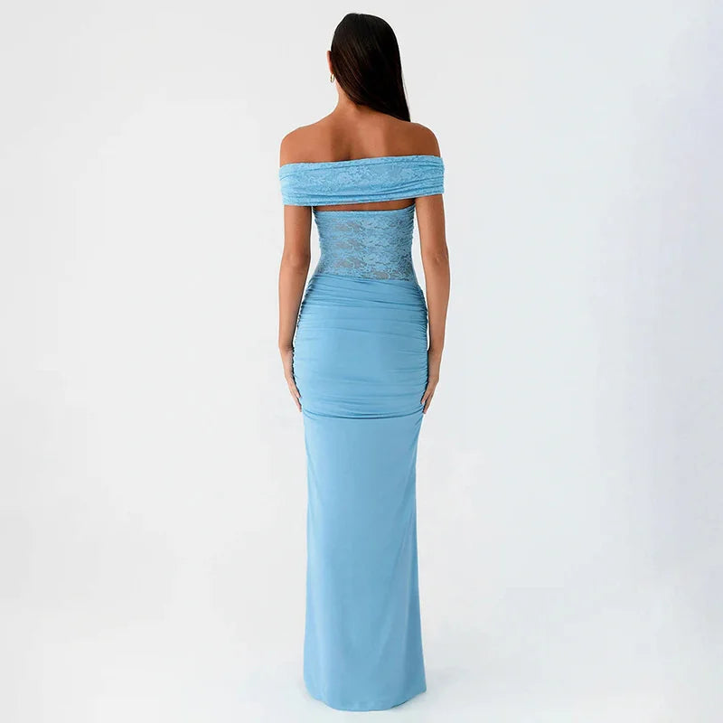 Woman wearing a light blue off-shoulder gown on a white background