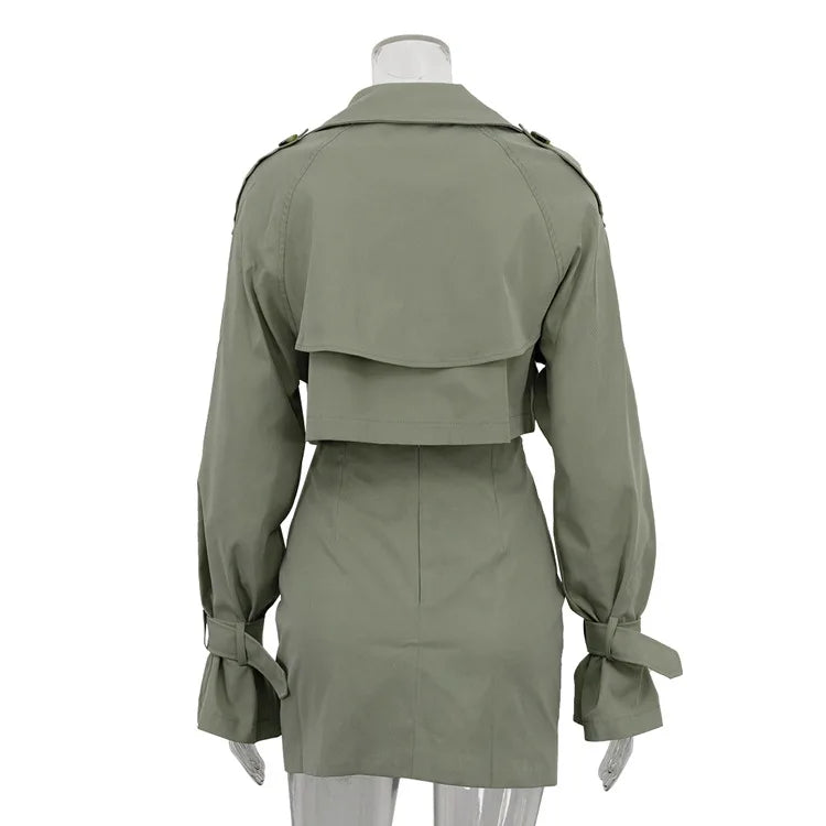 Green trench coat on a mannequin against a white background
