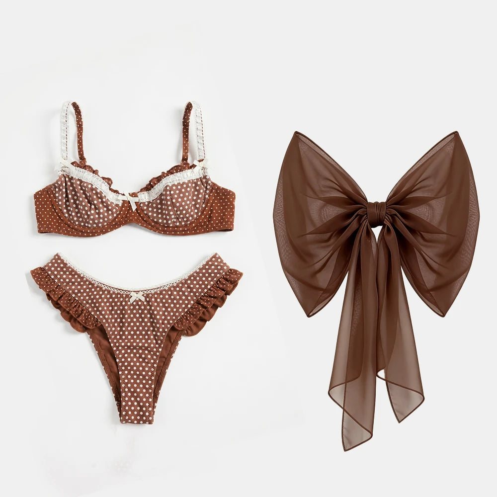 Brown polka dot ruffled bikini and skirt set with white lace trim.