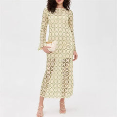 Woman wearing a patterned dress on a white background