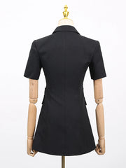 Black dress on a mannequin against a white background