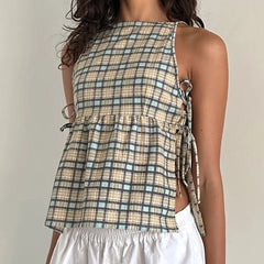Plaid sleeveless top with a tie detail on a plain background