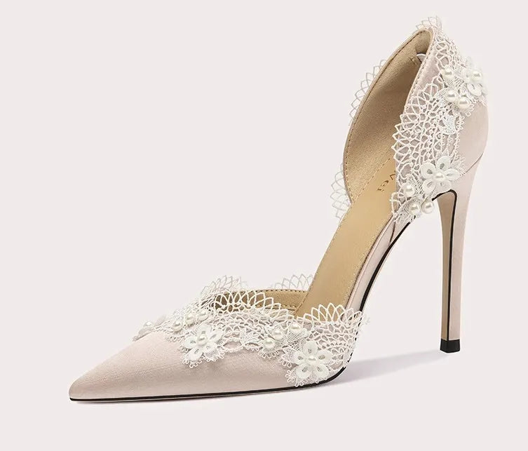 High-heeled shoe with lace detailing on a white background