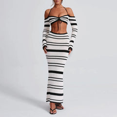 Black and white striped outfit on a plain background