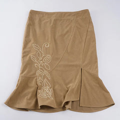 Brown skirt with floral embroidery on a white background