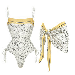 White polka dot square neck swimsuit with yellow trim and tie sides, paired with a matching yellow and black polka dot scarf.