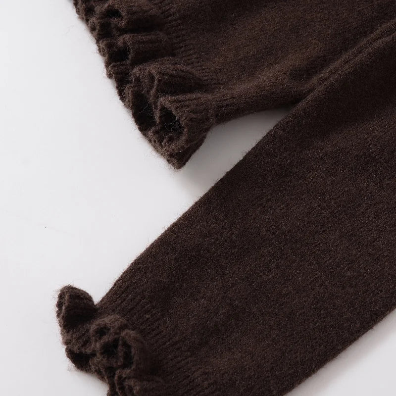 Brown knitted leg warmers on a white background