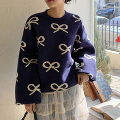 Women’s round neck jacquard sweater with bow design for autumn.