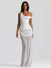 Woman wearing a white one-shoulder dress 