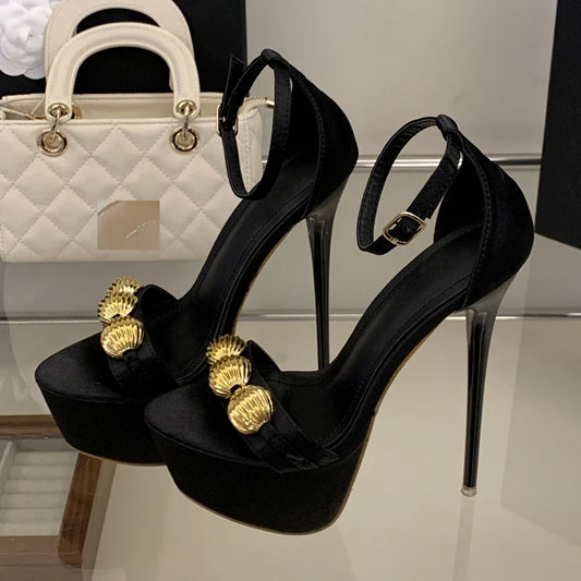 Side view of black platform stiletto sandal with ankle strap