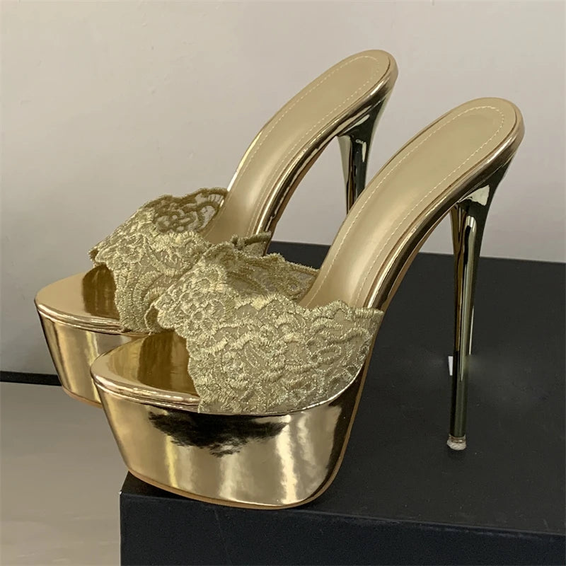 Gold high-heeled shoes with lace detailing on a black platform.