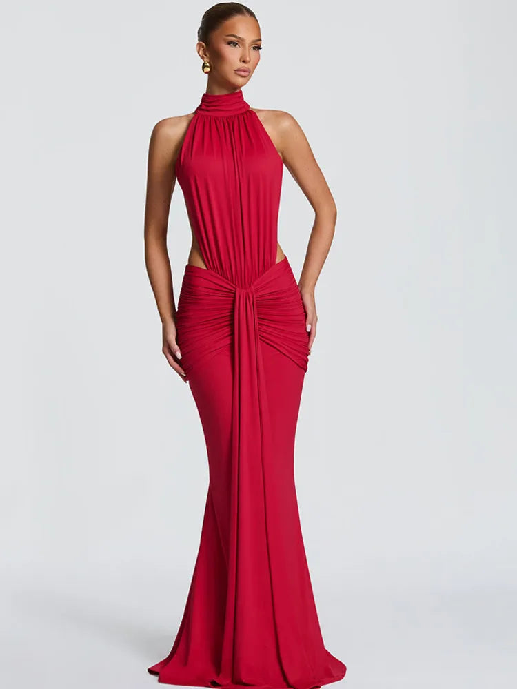Red evening gown on a model against a white background