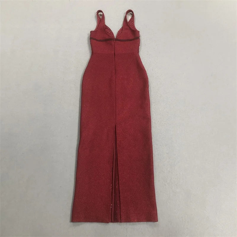Back view of a sleeveless red formal gown with a slit