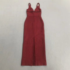 Back view of a sleeveless red formal gown with a slit