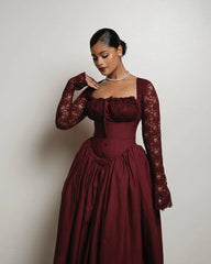 Women's lace dress with a high neckline and long sleeves.