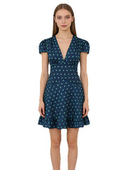 A-line mini dress with V-neck and puff sleeves on a model