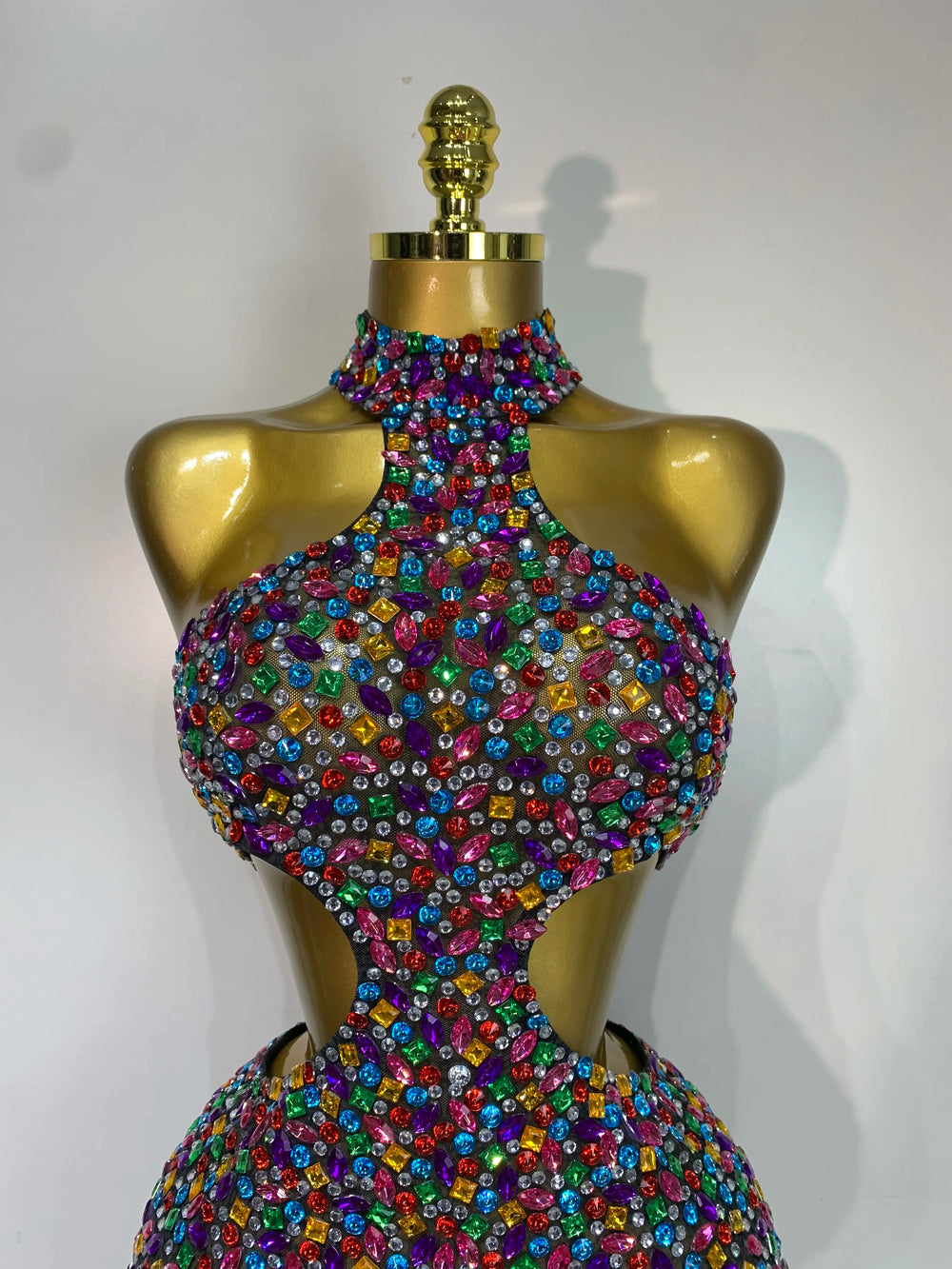 Close-up of the bodice of a halter neck rhinestone mini dress