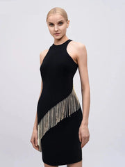 Black dress with gold fringe details on a model against a light gray background, brand 'Modphy' visible.
