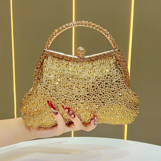 Gold crystal-encrusted top handle clutch bag