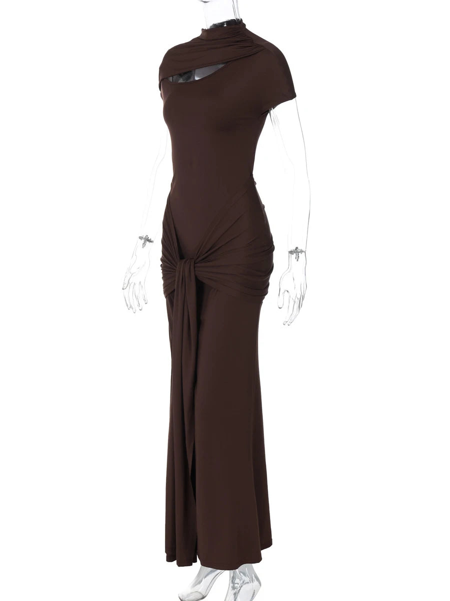 Brown evening gown on a mannequin against a white background