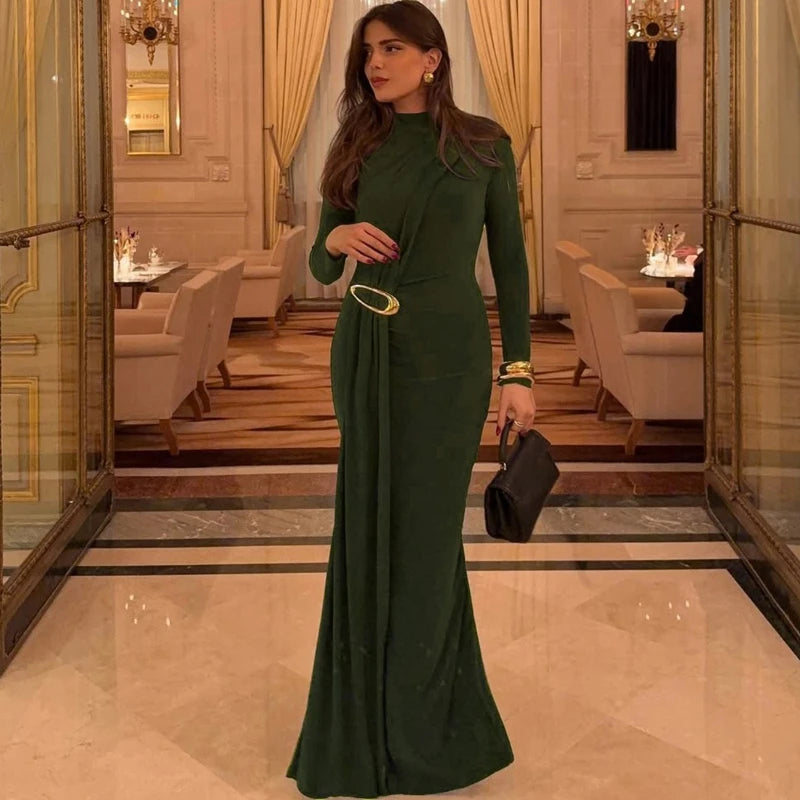 Elegant winter green evening gown shown with full sleeves and A-line flow.