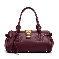 Burgundy studded lock top handle bag