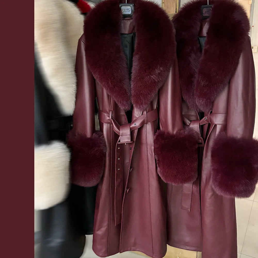 Maroon leather coat with fur trim on a rack.