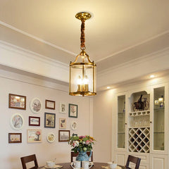  Modern copper chandelier with glass accents, hanging in a luxurious dining room setting. Golden Atelier 3