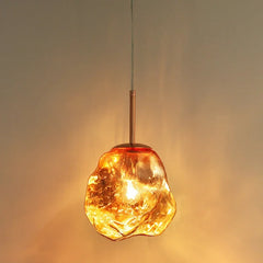 Close-up of the pendant light, showcasing the unique texture and translucency of the ice glass. Golden Atelier 3