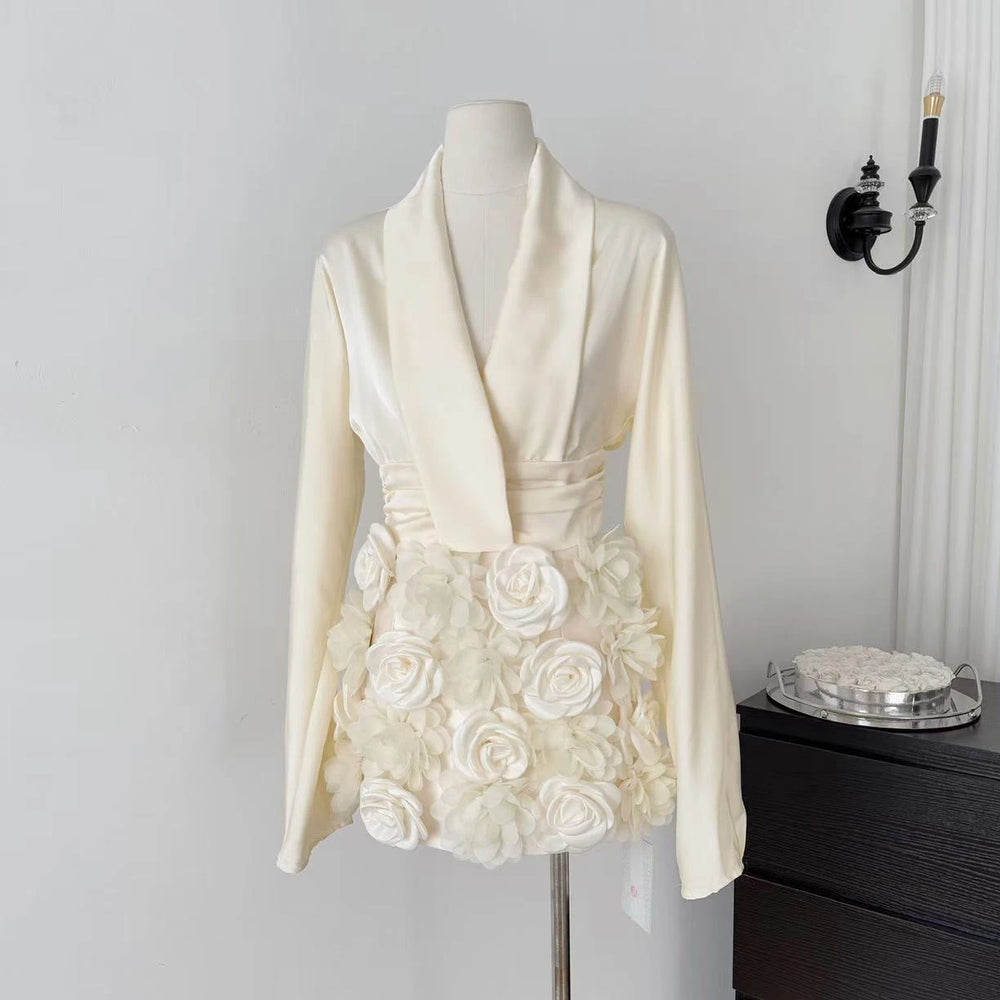 White floral jacket on a mannequin against a plain background