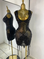 Black embellished mesh sheath mini dress with crystal details.