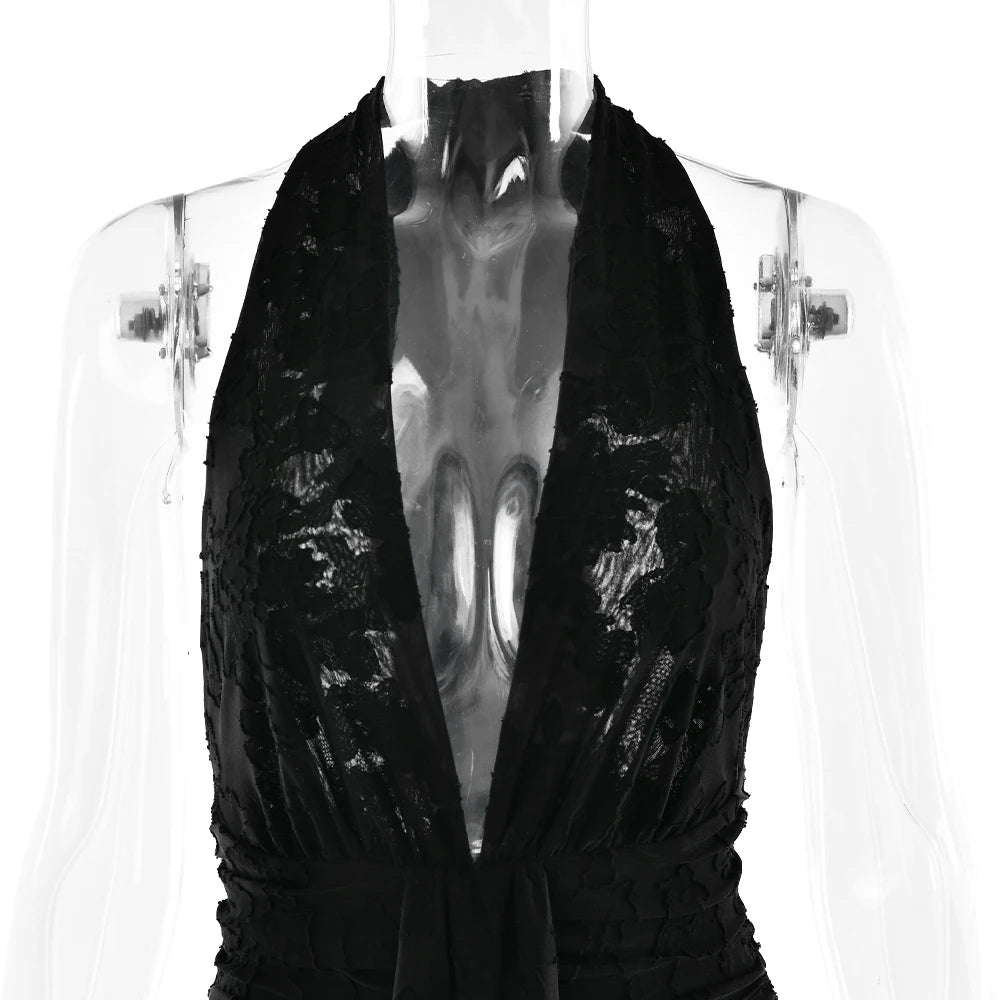 Black sequin dress on a mannequin against a white background