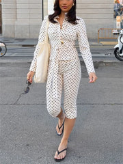 Woman in a polka dot dress walking on a street