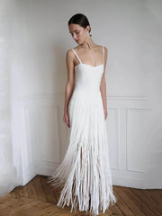 White spaghetti strap fringe maxi dress in a room