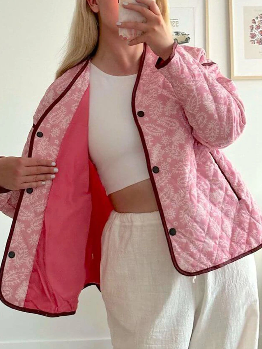 Open quilted jacket with pink paisley print, showing lining