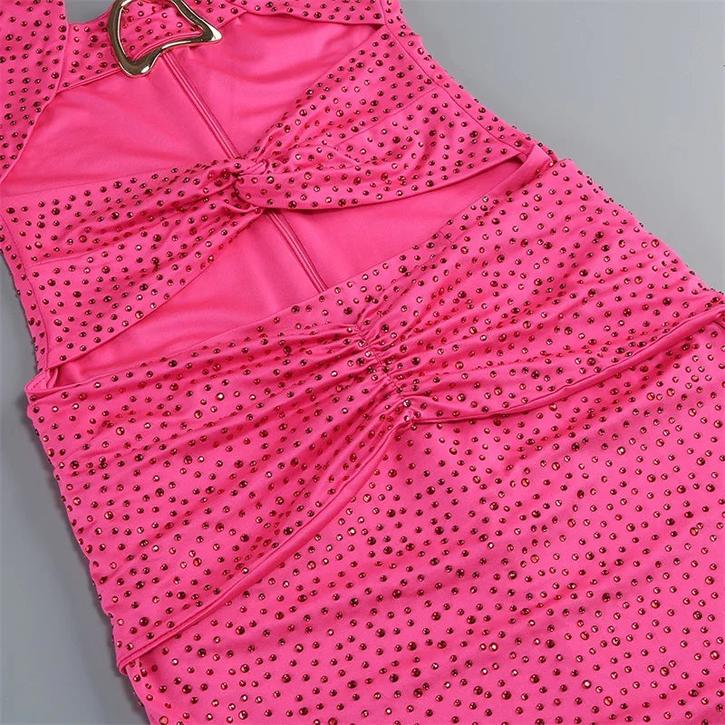 Pink dress with sequin detailing on a gray background