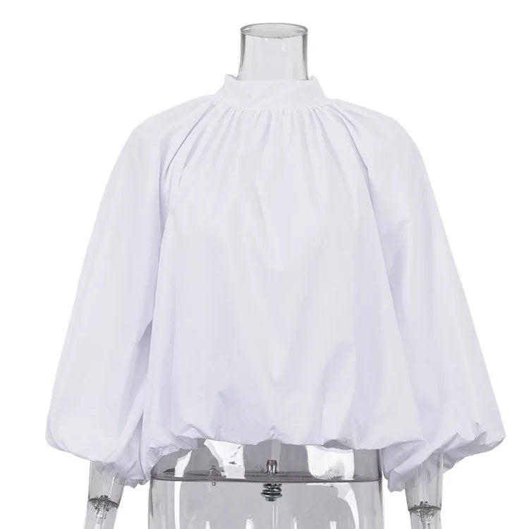 White blouse on a transparent mannequin against a white background