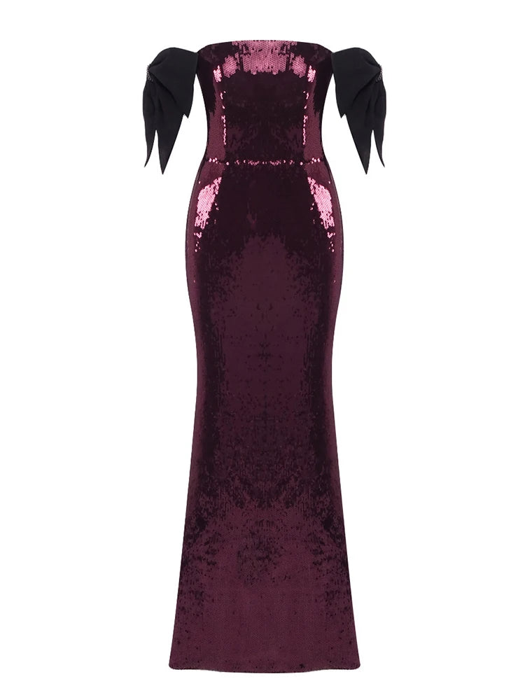 Purple sequin dress with black bows on a white background