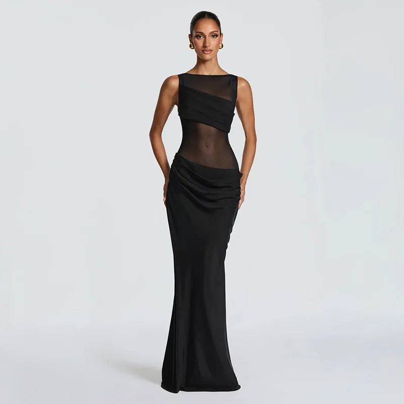 Woman wearing a black evening gown on a light gray background