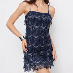 Sparkle sequin embellished mini dress with spaghetti straps.