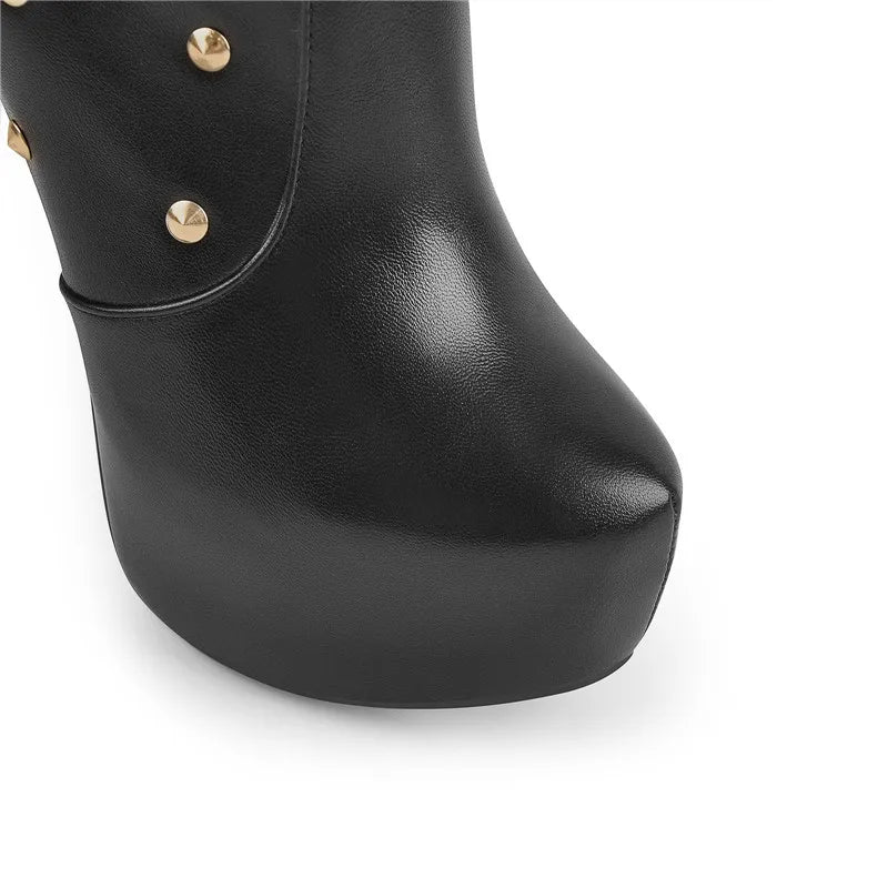 Close-up of platform toe on studded stiletto boot