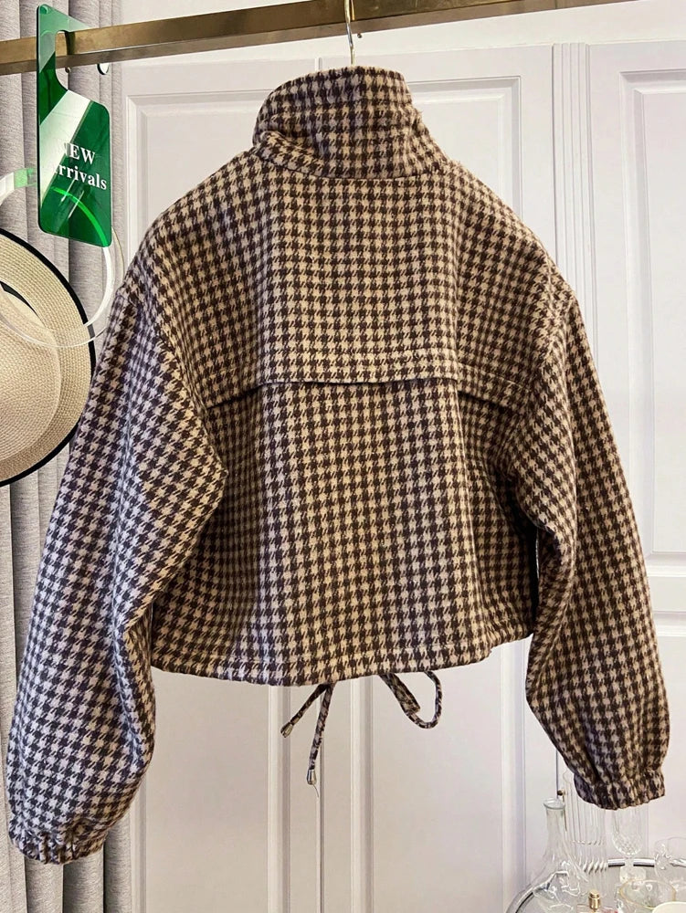 Houndstooth print cropped bomber jacket with stand-up collar and drawstring hem, back view.