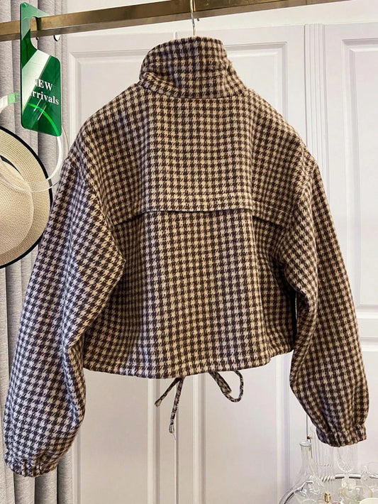 Houndstooth print cropped bomber jacket with stand-up collar and drawstring hem, back view.