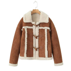 Brown suede jacket with white fur lining on a hanger against a white background